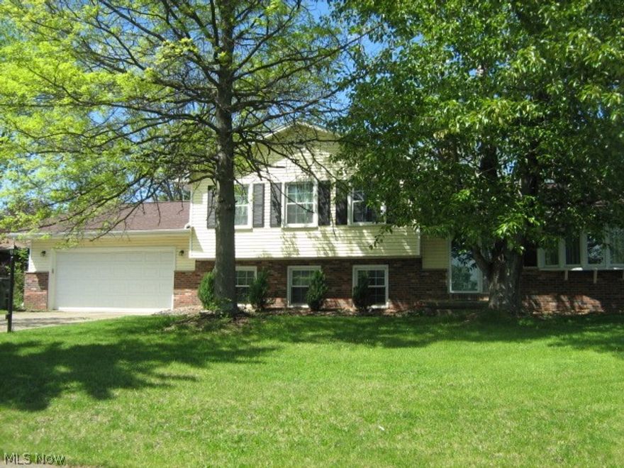 Spacious 4 BD 4-level Split with lots of room for a family to spread out. Vaulted ceilings in living/dining rooms, foyer with double guest closet. 3 BD and bath on upper level with new carpet and newer windows. Lower level has carpeted family room with built-in bookshelves and floor to ceiling stone gas fireplace, 3 season sunroom, fourth bedroom and bath. Newer vinyl siding, roof, furnace, bathroom and kitchen floors. Unfinished basement with laundry area and abundant storage space. Enjoy summer at the lake! (Wyoga Lake Assoc. membership optional.) Immediate possession.
