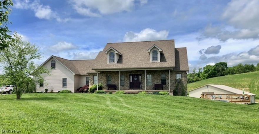 Live in your own country resort! 12 acres m/l & custom built home with room for everyone.  The main floor has vaulted ceilings in the master Br and living room, with custom built hickory cabinets, bookcase, electric fireplace and floors. Open concept living with natural light, and views out the front and back of rolling Ohio countryside.  10 foot deep stocked pond with swimming platform and slide and if pond water isn't to your liking then float on the 33' round pool with large deck. The home has some many features it's impossible to list here. See the attached feature sheet in the documents.  Mother in law handicap compliant suite with full kitchen in basement. Huge bathroom and bedroom too.
The crowning jewel on this property is the 50x52x12ft high building that is completely finished inside with rough sawn lumber, a restroom, a bar area, pool table , and plenty of room for any use you can think of.  Weddings, B&B, reunions, parties, or start a winery, or other business.  The possibilities are vast  The decor and furnishings in the building are negotiable, as well as some of the home furnishings.  Owners are downsizing so they will be happy to entertain any offers of their decor.  TWO geothermal systems in place for the home and building. This property will take your breath away!   Additional 10acres m/l north of the parcel is available for​​‌​​​​‌​‌​​​‌‌​​​‌‌‌​​‌​​‌‌​​​​ $49900