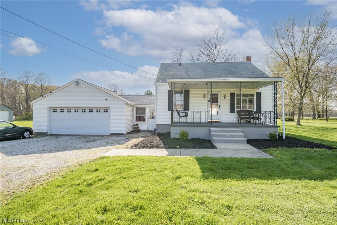 Welcome home to 14580 Hametown Road! Don't miss this cozy bungalow sitting on a full acre lot with serene country views! Your main level boasts a large eat-in kitchen offering new cabinets and luxury vinyl flooring. A living room and a great sized bedroom sit around the corner, both featuring hardwood floors. Down the hall is a beautiful modern full bathroom renovated in 2022. Venture upstairs to find a large master bedroom with extra closet space. Your laundry area is on the lower level along with a workbench and plenty of storage space. A breezeway conveniently connects the garage with the rest of the home and has entry from both the front and back yards. The heated double car garage includes water, gas, and electric along with a workbench and overhead storage. Enjoy swinging on your front porch and entertaining guests in your oversized backyard! New furnace and A/C 2021. 12 x 16 shed. Don't let this home get away. Schedule your private viewing today!