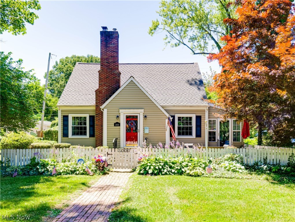 You will not believe the charm this lovely West Akron home boasts! Excellent location on an iconic street close to Sand Run Rd. A true "white picket fence" dream come true. Don't let it fool you, with 1460sq ft. above grade (additional 280sq. ft. in the lower level rec. room) there is room to spread out and relax. So many details such as gorgeous hardwood floors, ample storage space, crown molding, plantation blinds and shutters, and arched doorways give this home a feeling of joy. Spacious family room with fireplace. Updated kitchen with stainless steel appliances. Enjoy a book, a nap or even a meal in the inviting sun room which can be used all year round. The Living room (currently being used as bedroom) is a multifaceted space that could fit whatever needs you have (office, playroom, craftroom, etc). Dining room and half bath complete the first floor. There are three very spacious bedrooms in the second level. The master bedroom has two walk-in closets and fireplace. Updated full bath concludes second level. The lower level rec room is waiting for your touch but adds an additional place to hang out. The driveway to the garage is conveniently located on Winston which also allows for easy (low traffic) guest parking. Don't forget to admire the quaint outdoor courtyard with brick patio and lovely landscaping. Important updates to note: Roof (4 years), Furnace/ AC (2012), Kitchen (6 years), stove/fridge (2024). Do not miss out on the charm and warmth this home offers.