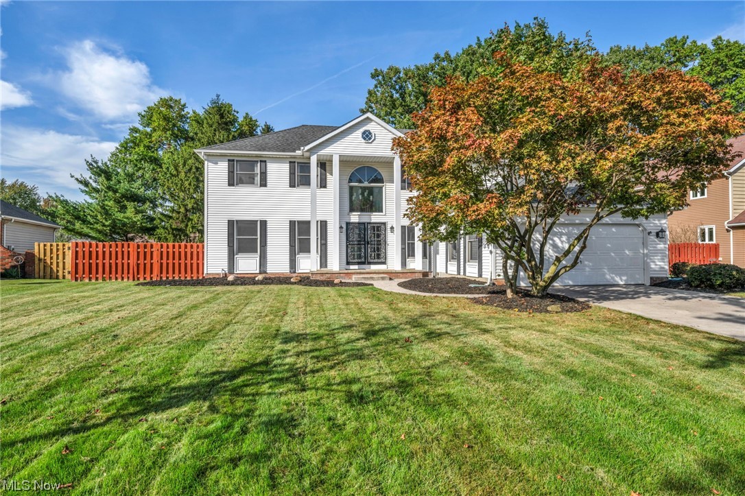 Discover your dream home in North Ridgeville! This stunning 3300 sq ft colonial masterpiece nestled on a quiet cul-de-sac is a true gem. With 4 spacious bedrooms, 2.5 bathrooms, and a convenient office, there's room for everyone. As you enter, be captivated by the grand 2-story foyer adorned with a magnificent winding staircase. The seamless flow leads you to a cozy living room, a formal dining room, and a large eat-in kitchen that opens up to the inviting family room with a fireplace, perfect for gatherings and relaxation. Upstairs, a luxurious master suite awaits, featuring an extra-large private bath and separate shower, your personal oasis for unwinding after a long day. The finished basement and garage boast nature stone flooring, adding an elegant touch to the practical spaces. Plus, enjoy year-round comfort with the brand-new furnace and AC. Step outside to a serene stamped patio with gas line for outdoor gill, a beautifully treed lot, and a fully privacy-fenced yard, offering t