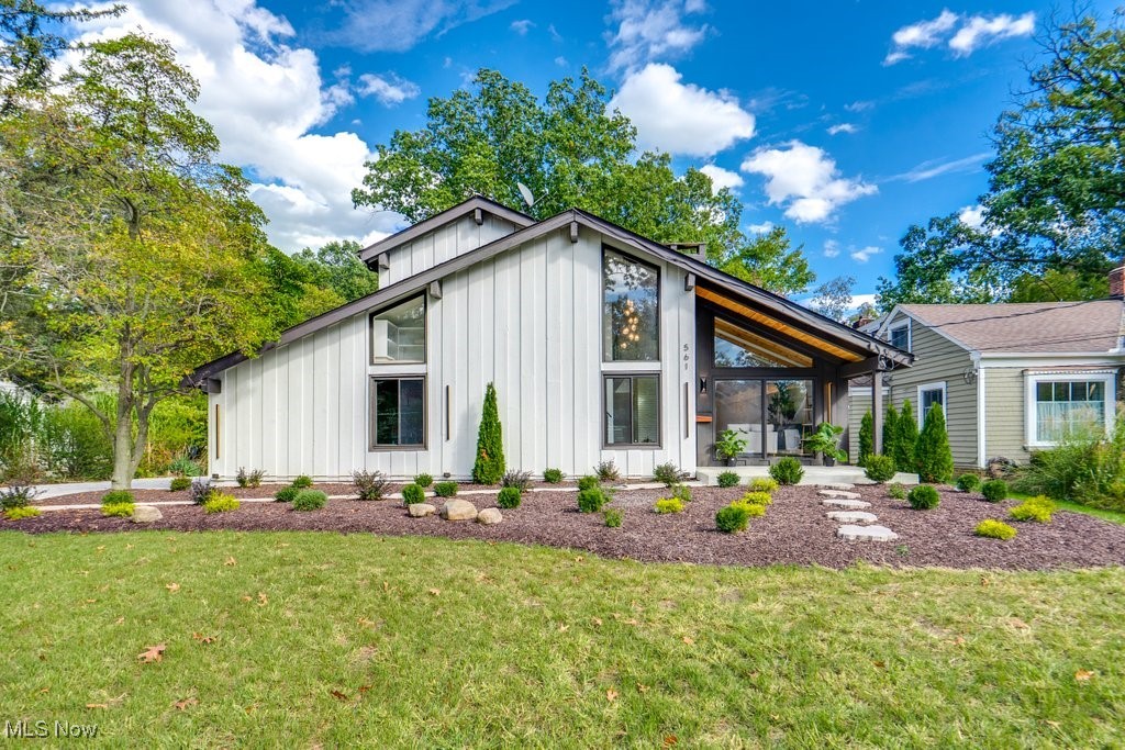 An extraordinary residence, masterfully reimagined for modern luxury, awaits on one of Bay Village’s most sought-after streets. Resting on a private 0.70-acre lot surrounded by mature trees, this home balances architectural elegance with the beauty of nature.
Step inside to a light-filled open design where panoramic folding glass doors frame the outdoors and open to a brand-new Amish-built deck. Overlooking serene greenery, this expansive outdoor retreat creates a seamless connection between the home and its natural setting—ideal for alfresco dining, hosting gatherings, or quiet evenings. The chef’s kitchen is a true centerpiece, anchored by a marble waterfall island and outfitted with KitchenAid professional appliances, double gas ovens, brass fixtures, and a custom backsplash. The open-plan dining and living areas flow effortlessly together, with designer lighting, wide-plank flooring, and dual fireplaces adding warmth and sophistication.Each of the three bedroom suites is designed as a private sanctuary with en-suite spa baths featuring soaking tubs, rainfall showers, and hand-selected tilework. In total, the home offers five impeccably styled bathrooms that rival a luxury resort.The finished lower level transforms into a private wellness and entertainment wing—complete with a custom wine room, sauna, dry bar, and media lounge. This flexible space is perfect for relaxation or entertaining on a grand scale.
Additional highlights include:Four-car garage (attached & detached) with ample storage.All new mechanicals and finishes: windows, doors, driveway, electrical, furnace, boiler, and fixtures. Refined architectural details throughout, including  chandeliers, modern railings, and designer flooring. Expansive yard offering both privacy and space to enjoy outdoor living .With its estate-sized lot, Amish-crafted deck, and serene natural backdrop, 561 Upland offers more than just a home—it’s a private luxury retreat where elegance and nature live in harmony.
