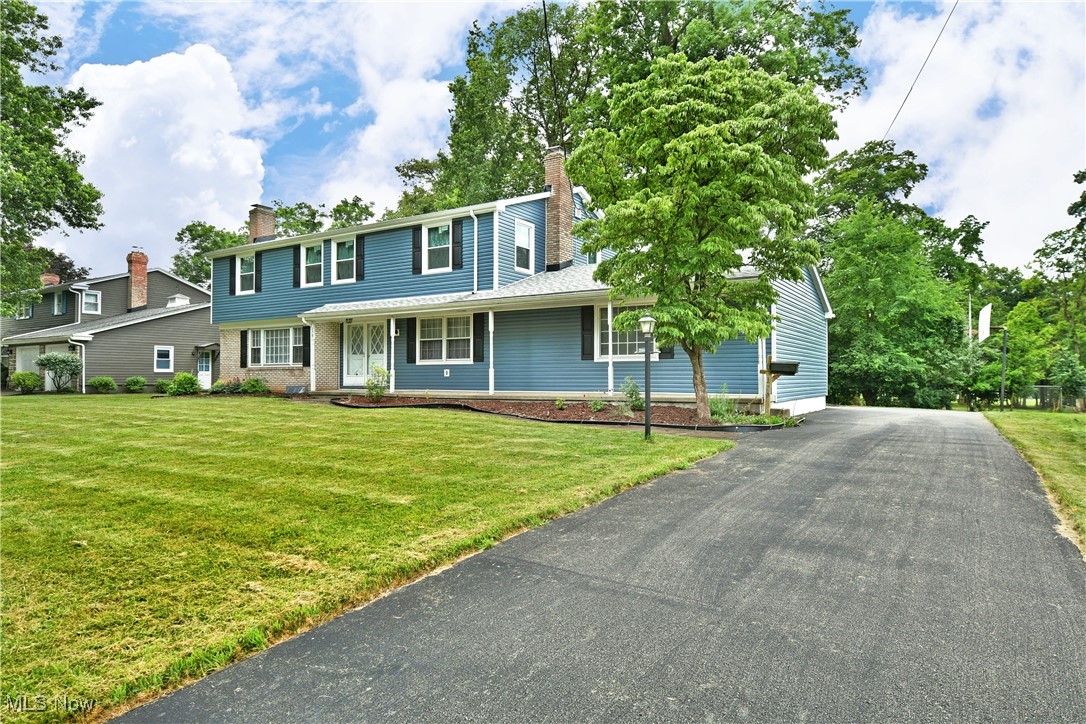 This classic colonial is loaded with major updates and is sure to impress! Welcome to 179 Southwoods Ave in Boardman! This nearly 2,800 square foot home packs a punch with 4-5 bedrooms, 4 baths and plenty of living space. Take note of the charming curb appeal as you approach the home. Inside a light filled living room showcases original hardwood flooring and a beautiful fireplace. Adjacent is the dining room complete with built-in hutch storage and french doors that lead to the sunroom. The large kitchen is steps away and is outfitted with tons of counter space, wood cabinetry, and updated appliances! Just beyond the kitchen is a convenient first floor laundry area, half bath, garage access, and a perfect guest room or home office! The wood lined family room is just across the hall providing a moody backdrop for a second fireplace. Upstairs, the oversized primary suite has a large walk-in closet, updated carpeting, and a full bath. 3 more large bedrooms feature ample closet space and original hardwood flooring and join a tandem full bath and powder room to complete this level. The lower level present so much opportunity for furtue expansion! Hangout space? Home Gym? Dream away! There is even plumbing in place for an additional bathroom! The basement houses mechanicals, storage space, and walk up access to the attached garage. What are you waiting for? Call today for your personal tour! **Updates: Roof 2020, Gutters 2021, Soffits 2021, Siding 2021, Windows 2021, Electric Panel 2024, Kitchen appliances 2024, Garage opener 2024, Sump Pump 2024, Driveway replaced 2021 and sealed 2024, Boiler Circulation Pump 2016, Thermostat 2025
