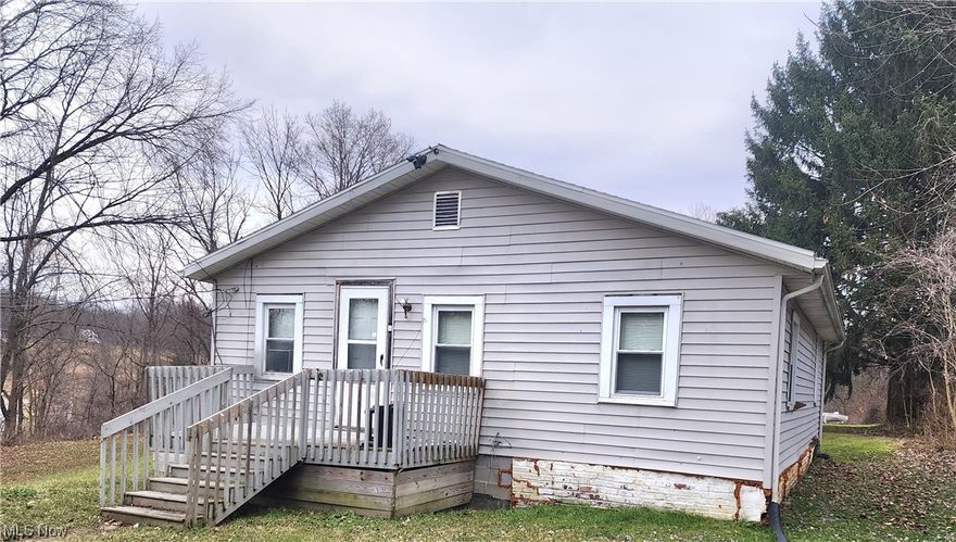 Convenient Location Just 2 Minutes from US 40 and 5 or 6 Minutes from I 70 East or West Access Contains 3.34 Acres in 
3 Parcels, a 952 Square Ranch With a 1 Car Basement Garage, Updated Furnace & Central Air, Plumbing & Roof, Kitchen, Bath
& Roof. Home has Rear Sun Porch, Main Floor Laundry, Large Eat-in Kitchen, a Central Room that has many potential uses. Could be a Formal Dining Room or Office or Family Room. 2 Bedrooms and a Nice Size Living Room, Gas Heat and Central Air.