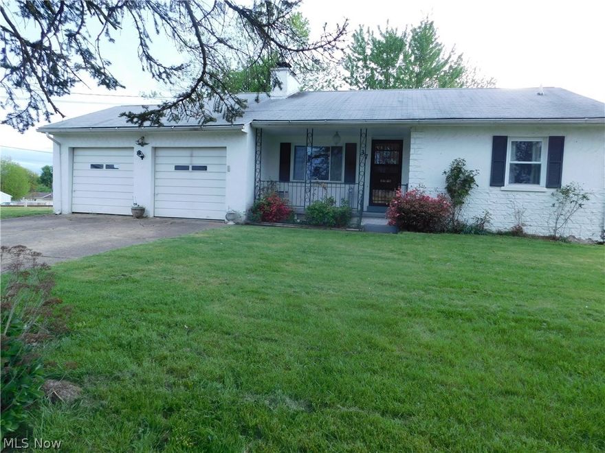 Just around the bend on a corner lot is this cozy 2 bedroom stucco ranch with a 2 car attached garage.  Beautiful hardwood floors in the living/dining room area that is open to the quaint little kitchen.  The basement, which is only accessible through the garage, would be a great area to have a workshop or just additional storage.  Currently there's washer and dryer hookups and half bath in the basement. This is an estate being sold as is.