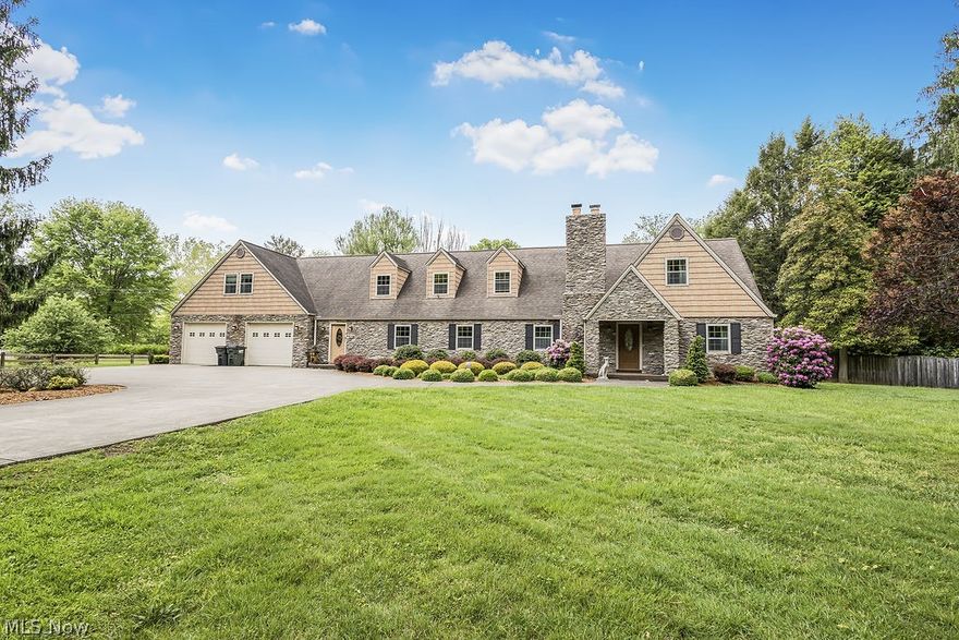 Welcome to this beautifully renovated 5/6 bedroom, 4 1/2 bath Tudor-style home situated on 1.67 acres in a convenient location.  From the striking modern stone exterior to the impressive circular drive, this property makes a statement from the start.  Inside you will find expansive rooms designed for comfort and entertaining with the beautiful custom kitchen and adjoining family room. Continue upstairs to find the beautiful-private master suite with just updated master bath.  The fenced lawn offers space for pets, play or peaceful outdoor living, additional quality features include a huge hot tub and Generac generator.