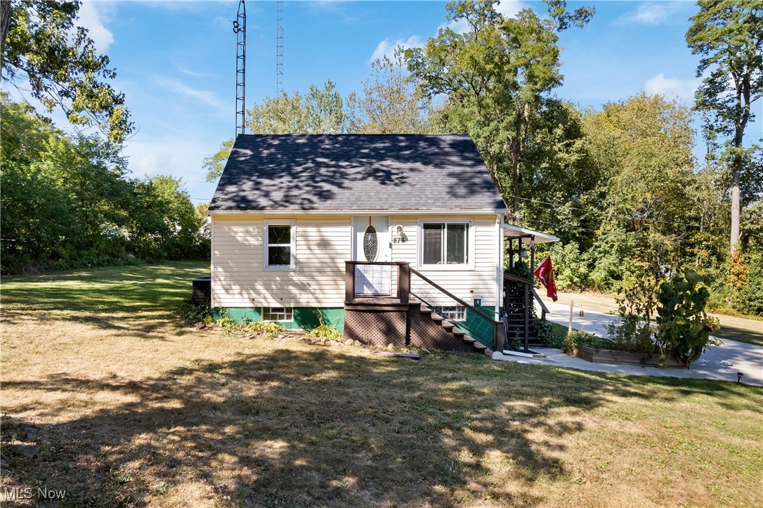 This is the cozy cottage house with so much to offer!!!! Everyone uses the back door to this welcoming country home! Here is affordable outdoor living at its best with a large 2 car garage with storage, big yard without too-close neighbors, and plenty of parking-- family and friends will love gathering here! The large covered deck greets you when you arrive before entering the homey dining area. As you enter, sit on the custom benches and appreciate being surrounded by beautiful views of the yard and the countryside. The small kitchen has loads of cupboards plus a portable dishwasher which will remain. The living room is cheery and comfortable. There is a full bath and regular bedroom on this floor plus a small 12x6 bedroom that would be a great office since it does not have a closet (but the auditor's site has counted it as a bedroom). In the dormered upstairs you'll enjoy the privacy of the master suite with a roomy, updated full bathroom and closet. The walk-out basement holds the laundry area on one side and plenty of storage on the other. Some of the updates include roof 2019, newer windows, 200amp electrical, sump pump. There are gutter guards in place and there is also an invisible fence installed. Avg. utilities: electric $160-220, water $90, gas has just been installed at the road. Please note there is surveillance in use when visiting the property. Home warranty being offered for extra peace of mind. If you crave outdoor space in the country with a cute small home you need to take a tour of this excellent property!