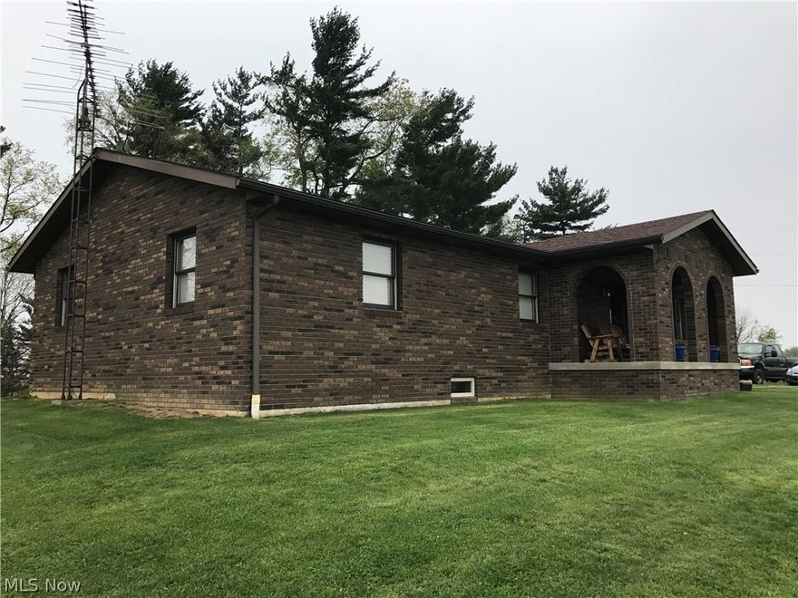 Country living at its finest!  One owner brick ranch with 3 bedrooms and 3 full baths with beautiful views of the country side!  Large 30x40 horse barn on the property featuring 4 horse stalls, tack room, sawdust bin and hayloft with large door to park your car as well.  Per seller foundation consists of 12" block filled with rebar steel rods and concrete.  Basement features high ceilings, finished bath and door to outside, and would be easy to finish!  Just minutes from StC!