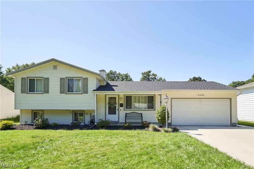 Welcome to this cozy and meticulously maintained split level home! As you pull into the driveway you will be immediately greeted by the newly paved driveway as of 2021, detailed landscaping and new roof as of 2018. As you enter the front door you will walk into a bright living room with vaulted ceilings and a partial wall. On the other side on the wall is your kitchen with stainless steel appliances and access to the 2-car attached garage. Also on the main floor is your dining area and sliding glass doors that welcome you to a fenced in back yard. The bottom portion of the of the house has a half bath, laundry room. The washer and dryer are new as of 2019 and the dryer has the option for gas or electric hook ups. Lastly on the bottom portion is a substantially large family room. In 2017 the owners left no details out when they installed a sump pump/ back flow preventer. The upper portion of this home has 3 great sized bedrooms and a full bath.