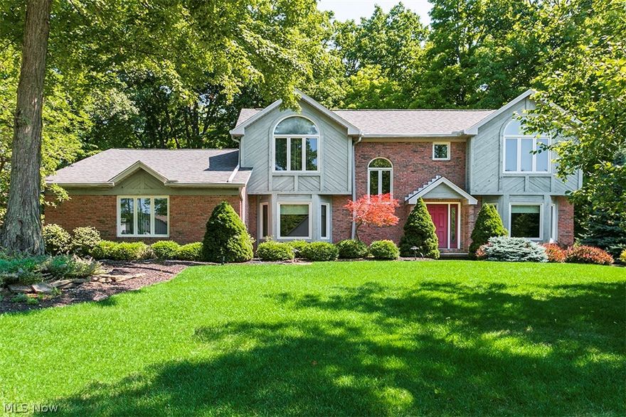 Fashionable 4 bedroom, 3-1/2 bath colonial type home with a contemporary flair, having a lst floor master bedroom, a cathedral ceiling great room with fireplace, and an awesome gourmet kitchen with wood floors and granite counter tops.  The foyer is large and open, there is a formal dining room, an office, a living/media room, 1st floor laundry and half bath, besides the huge master with an impressive master bath and extra large closet.  Off the kitchen eating area is a large deck with seating, overlooking the tranquil backyard.  Upstairs there are three nicely-sized bedrooms with two full baths.  The lower level has an immense amount of space, including a rec room, workshop, storage area and a very large bonus room.  All appliances remain with the home.  Recent updates include a newer roof, hot water tank and windows in 2016, as well as a generac generator with an automatic turn on when electric goes out.  It's a pleasure you'll treasure.