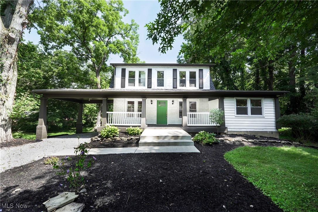 Check out this beautifully renovated home nestled among the trees in Akron in the Copley-Fairlawn School District! As you step inside, you'll be charmed by the inviting front porch—ideal for sipping morning coffee or savoring the refreshing summer breeze. Once inside, you'll discover a completely revitalized space featuring new electrical systems, plumbing, freshly installed carpet, and LVP flooring. The interior is adorned with fresh paint throughout. The updated kitchen boasts generous counter space for all your culinary adventures, along with brand-new stainless steel appliances and a stylish tile backsplash. Upstairs, you’ll find four spacious bedrooms equipped with plenty of closet space, complemented by two full bathrooms. Retreat to the partially finished basement, which includes a half bathroom while still offering ample storage. Spend your evenings in the backyard, a serene oasis surrounded by lush greenery.