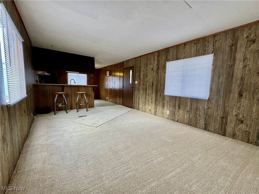 Welcome to 4199 Massillon Rd #11! This well-maintained mobile home offers a convenient location in the highly sought-after Green Local School District, close to highways, schools, restaurants, and other amenities. Inside you'll discover a large kitchen with ample counter and cabinet space, perfect for preparing your favorite meals. The open floor plan seamlessly connects the kitchen to a spacious living room, making it ideal for entertaining or relaxing. Enjoy the comfort of brand-new carpet throughout the home. Two generously sized bedrooms provide plenty of room for rest and storage, while the conveniently located hallway laundry adds to the home's functionality. Outside, you'll find a storage shed, perfect for tools or seasonal items. This property combines practicality with an unbeatable location—don’t miss out! Schedule your tour today!