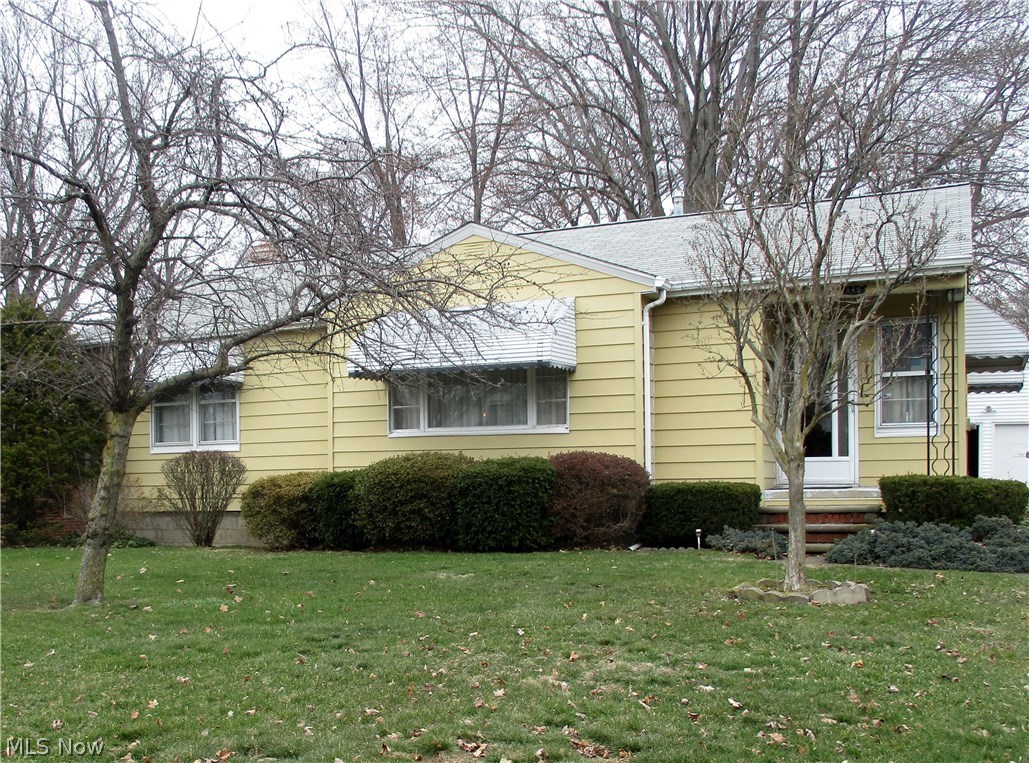 Welcome home to this cozy ranch home. It is situated only a few minutes away from downtown Amherst. In the basement, you will find an additional bath and a large finished area that can be used as a home office, rec room, or a laundry room. On the main floor, you will find 2 bedrooms and a full bath that is just waiting for your personal touches and design. There is a sun room off the dining room that looks out into the spacious backyard. There is also a two car detached garage.