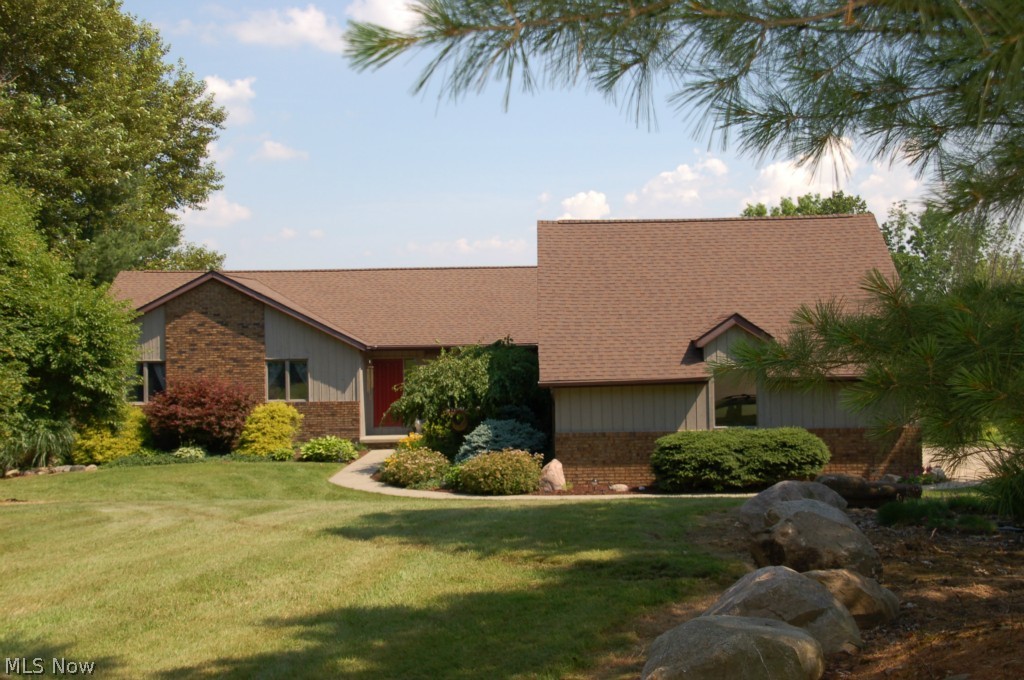 Tired of the hustle and bustle of everyday life? You will love coming home to this well cared for ranch on 6.35 acres. In the summer you can take a dip in the refreshing pond or take a row boat out for a slow relaxing ride. When winter comes you'll enjoy sledding down the backyard slopes. There are beautiful views from every room whether it is the bedrooms, formal dining and living rooms or the kitchen or great room. The great room features a floor to ceiling stone fireplace and a sliding glass door that leads to the fabulous deck. A bright and sunny kitchen with a breakfast bar adds to the openness of this section of the house. 691 finished square feet of the walk out basement leaves plenty of storage space on the lower level. Updates: Roof '11, furnace 6 years old, hot water tank '11.What are you waiting for? Call today to make your appointment to see your next home.