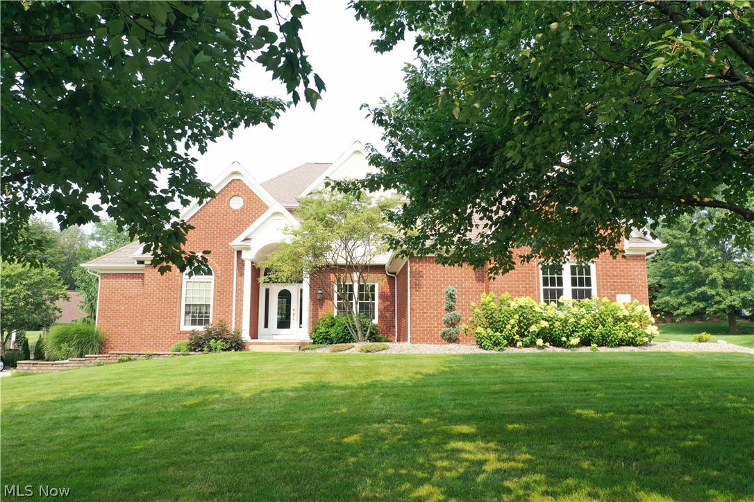 This Absolutely stunning home sits on a cul-de-sac on nearly an acre in St. Ives! The first impression is jaw-dropping when you enter and immediately see the two-story great room with a floor-to-ceiling fireplace. A formal dining room and den also greet you at the entry. The first-floor owner's suite is vaulted with private access to the deck. The owner's bath has double sinks, a large walk-in closet, and jetted tub. The kitchen is bright and nicely equipped with newer Kitchen Aid appliances, a walk-in pantry, access to the deck, granite counters, and tile flooring. Three generously sized bedrooms are on the second floor, plus another full bath with double sinks. Entertaining & relaxing are a breeze in the lower level finished space. An expansive recreation room features a second fireplace, built-in shelving, and a wet bar with a mini-fridge. The 5th bedroom with an egress window is suited well for a teenager or guests. For convenience, another full bath and second laundry are on this