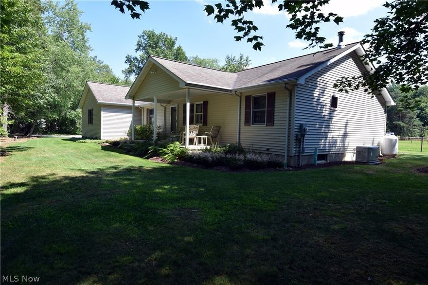 Don't just buy a house . . . buy a way of life.  Peaceful country is the ideal setting for this open-concept ranch on almost 10 acres.  Built in 2003 with very nice materials and workmanship, you'll appreciate the open floor plan of this split ranch.  Your guests will be welcomed from the covered front porch into the inviting great room with plenty of room for entertaining.  You'll enter from the attached 2-1/2 car garage either directly into the basement or into the laundry room which has plenty of maple cabinets, two large coat closets, wash tub, pantry, washer, dryer, second fridge and a place to leave the muddy barn boots.  From there, you'll enter the great room with an abundance of maple kitchen cabinets, a large dining area and the great room.  From there you can see the pasture and woods from the dining area or step out to the covered back porch to watch the horses. The master suite is on one side of the home and two bedrooms and full bath are on the other side. Let's not forge