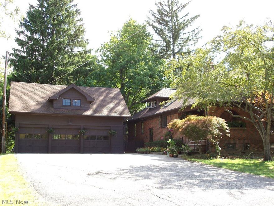 Classic Brick Home... 3-4 Bedrooms, 3 Bathrooms... Oversized 3 car garage with walk up storage on 2nd floor...Private backyard with ravine and creek....