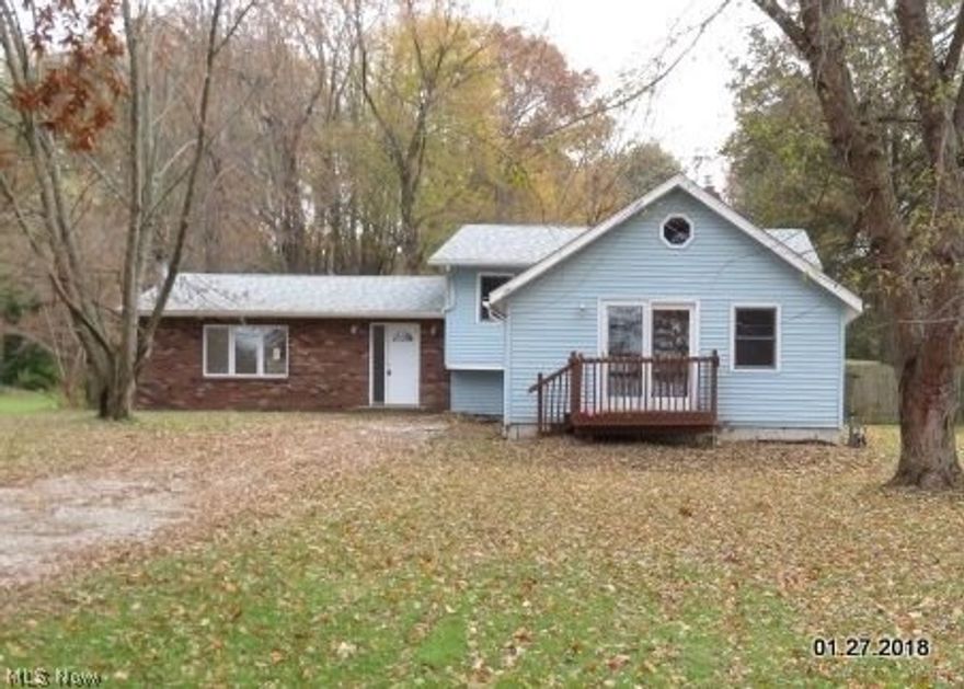 Must see this lovely split with 3-bedrooms, living room with fireplace, freshly painted interior, new flooring throughout, newer furnace, updated kitchen and baths, also has a dinette area with French doors leading to deck and large fenced in yard. The second level has the master bedroom with a master bath, full bath off the main hall, a second bedroom, and what was a 3rd-bedroom or can be a nice computer room with steps leading to an area with a full bath, a large room for another bedroom,  and a side room for a closet.  The septic system has been tested and passed, the only thing left is the home needs a well test.

Close to I-77, shopping and Portage Lakes State Park. Property Sold AS-IS. (Buyer to verify square footage of lot and structure)