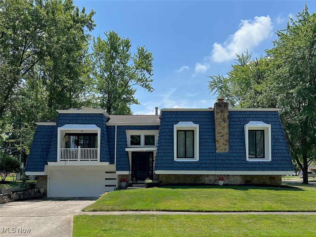 This beautifully renovated 4-bedroom, 2-bath cedar-sided home offers the perfect blend of space, modern convenience, and stylish finishes. Situated on an established tree-lined street in a quiet neighborhood, this home is ideal for those who appreciate natural light, a great location, and a thoughtfully designed layout.
Step inside to a welcoming entryway with wide open stairs leading you to a stunning great room with floor-to-ceiling windows and a balcony that brings a piece of nature in. The high ceilings and bank of sliders flood the space with light and offer an impressive setting for everyday living or entertaining. Toward the rear of the home, you’ll find the heart of the house: a tastefully remodeled eat-in open concept kitchen (2024) featuring updated cabinetry, contemporary finishes, and a welcoming space for gathering.
All four large bedrooms are conveniently located opposite of living areas on the main level, offering comfort and flexibility for families or guests. The lower-level recreation/family room is designed and remodeled for family gatherings, game or movie nights or quiet evenings in front of the fireplace. This well-appointed recreation room is complete with projection TV, stone wood burning fireplace, and a newly remodeled second full bath—ideal for game days, large get-togethers or cozy nights.
Additional highlights include a bonus storage room, updated laundry roam with washer/dryer and direct access to an oversized 2.5-car garage. New barn doors on lower level allowing flex space, and much more. Don’t miss your chance to own this move-in ready home that combines character with modern upgrades in a highly desirable setting.