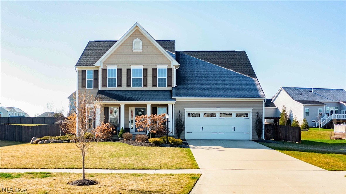 Welcome to your dream home at 5546 Coverdale Way, a stunning property nestled in the heart of Medina, OH. This meticulously crafted house is not just a place to live, but a sanctuary designed with attention to detail and an eye for elegance. Spanning over 2,412 sqft of living space, this residence is a testament to thoughtful design and superior craftsmanship. As you step inside, you are greeted by a warm and inviting atmosphere, accented by an array of interior features that elevate everyday living. The heart of this home is its great room, anchored by a custom-built fireplace with stacked stone and a handsome mantle, creating the perfect backdrop for memorable gatherings. Natural light floods the space through wireless shades, illuminating the refined aesthetics, including built-in bookcases in the study, adding charm and functionality. Culinary enthusiasts will delight in the eat-in kitchen, boasting an oversized island complemented by pendant lighting and a subway tile backsplash. The space is designed for both entertaining and daily life, seamlessly merging style with utility. Completing the main level, an improved mudroom offers an elegant solution to keeping the home organized. Upstairs, comfort meets style in the master bedroom, adorned with a board and batten wall, offering a serene retreat. The second floor laundry room, enhanced with shiplap and shelving, elevates the convenience of daily chores. The home's appeal extends beyond its walls to the outdoors, featuring a concrete stamped patio installed in 2019, professionally landscaped grounds with garden beds, and enhanced by outdoor lighting. A fenced-in backyard, added in 2021, ensures privacy, while the pergola invites outdoor relaxation and entertainment. Not to be overlooked, the full finished basement and workshop provide additional space for hobbies, storage, or further customization to suit your lifestyle.