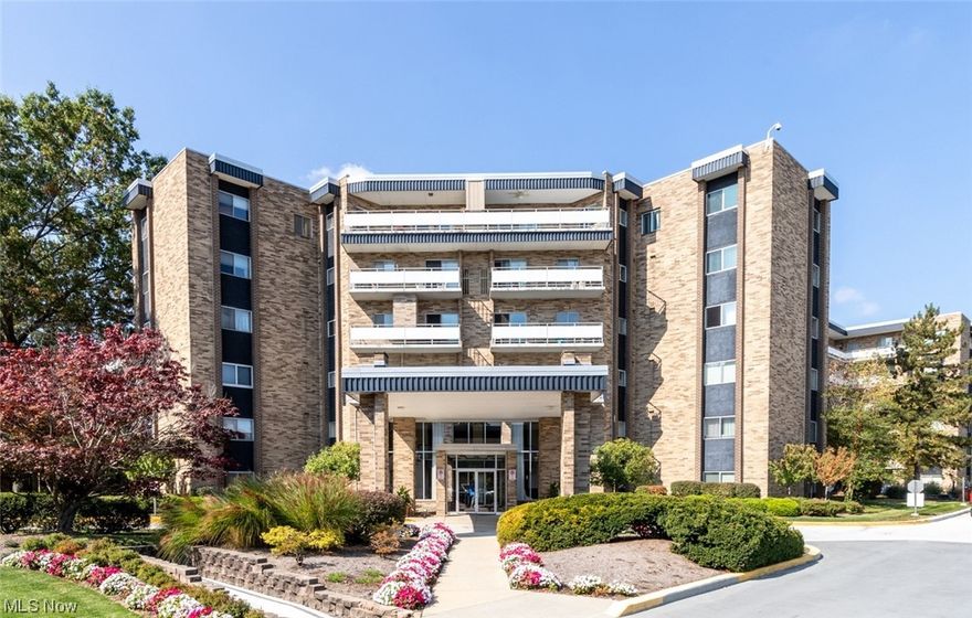 Rare first floor unit in Acacia on the Green with in suite laundry! Elegant, tasteful decor with mostly updated baths and kitchen! Versatile floorplan. Foyer with ceramic tile opens to large combination living and dining rooms. Sliding doors in living room open to lovely, private patio with landscaped garden, perfect for outdoor dining on sunny days. Den off living room could become an additional living suite with en-suite half bath, and built-in desk and shelves. Laundry closet in den holds washer/dryer. Eat-in kitchen with newer appliances, gas range and Corian counters has ample storage and easy to maintain laminate floors. Spacious master suite with updated full bath offers great view. Second bedroom with adjacent full bath in hallway. Acacia offers excellent facilities including underground parking with garage space at $50.00 per month; 24/7 security, fitness room, Social Room and amazing swimming pool recently renovated with grills! Tennis courts for your enjoyment! Great location directly next to Acacia Reservation of the Cleveland MetroParks, convenient to Beachwood Place/LaPlace and Legacy Village, major Medical facilities and easy I-271 access! Ready to move in!