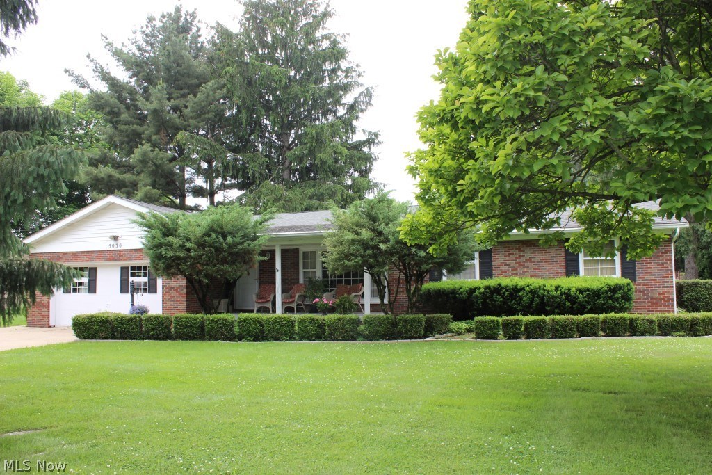 Beautifully cared for & maintained brick 3 bedroom/1.5 bath ranch with 1555SF plus 649SF in finished basement, 4 car (2 attached & 2 detached) garage on .46 acre on quiet street* Starting with an inviting covered front porch into a pretty interior, light & bright with oversized windows & neutral décor* Living room with large picture window* Dining area with garden window* Oak kitchen, ample cupboard space & includes range, refrig, microwave, dishwasher & disposal* 1st floor family room with brick wall gas log fireplace & access to deck* 3 bedrooms with wood floors under carpet* Basement with office, recreation room & workshop* Attached 2 car garage with glazed block walls* Detached 24x24 garage with workshop* Deck with built in natural gas grill* 30 year single layer shingles (house, detached garage & shed) (2009)* Updated septic (3/2015)* Washer and dryer included*
