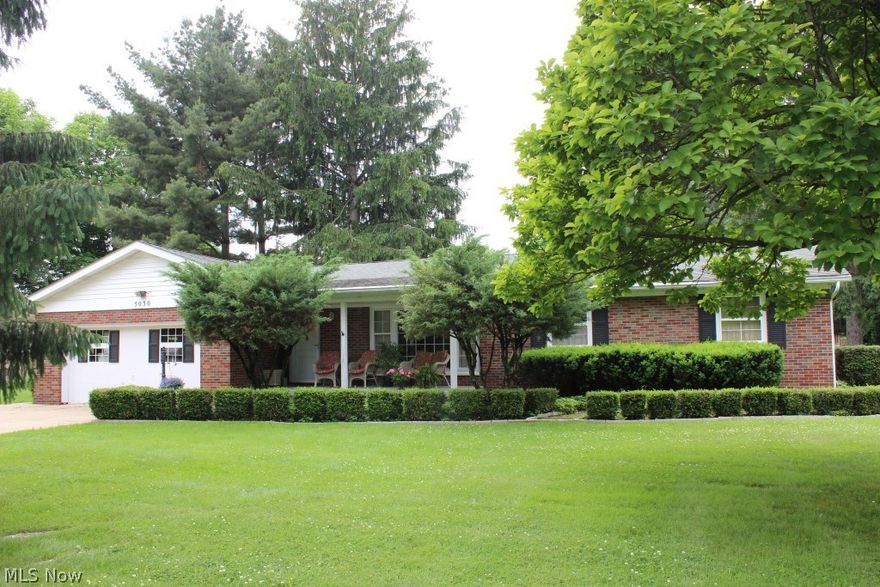 Beautifully cared for & maintained brick 3 bedroom/1.5 bath ranch with 1555SF plus 649SF in finished basement, 4 car (2 attached & 2 detached) garage on .46 acre on quiet street* Starting with an inviting covered front porch into a pretty interior, light & bright with oversized windows & neutral décor* Living room with large picture window* Dining area with garden window* Oak kitchen, ample cupboard space & includes range, refrig, microwave, dishwasher & disposal* 1st floor family room with brick wall gas log fireplace & access to deck* 3 bedrooms with wood floors under carpet* Basement with office, recreation room & workshop* Attached 2 car garage with glazed block walls* Detached 24x24 garage with workshop* Deck with built in natural gas grill* 30 year single layer shingles (house, detached garage & shed) (2009)* Updated septic (3/2015)* Washer and dryer included*