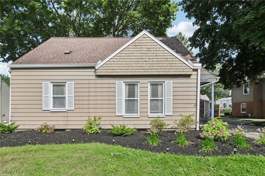 This Cuyahoga Falls Cape Cod is extraordinary, filled with warmth, charm, and updates. Step inside the front door into the eclectic dining area, which was just freshly painted. The hardwood floors gleam throughout the first floor of this home. The kitchen, located in the heart of the home invites you in with rich oak cabinets, custom glass door details, and newer stainless steel appliances. A pass-through opening overlooks the living area for entertaining. The living room is spacious, and flooded with natural light by the sliding glass doors that lead outside. The first floor is completed by two bedrooms and a full bathroom. The primary bedroom upstairs is unlike any other Cape Cod second floor. It features ample custom built-in storage, more hardwood floors, and a adorable office nook. The basement has been finished for more living space, and is currently set up with a cozy guest area as well. The second bathroom located in the basement was built in 2020 and features custom tile floors, double vanity, and a tile shower surround. Other updates include gutters with leaf guards in 2018, and central air installed in 2021. Outside, you'll find a detached 1-car garage, with a shed for lawn item storage, and separate studio like space perfect for hobbies. A securely fenced in yard completes with home for your fury family members! This Cuyahoga Falls stunner will go fast, so reach out to your favorite Realtor to see it with your own eyes.
