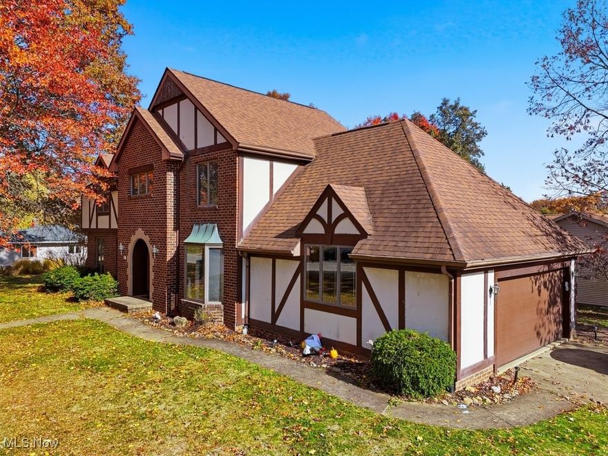 Gorgeous Tudor home in Austin Estates. Hardwood flooring throughout. First floor features a mudroom/laundry entrance from the 2-car garage. There is an eat-in kitchen with stainless appliances, window seat and walnut cabinetry, granite counters. There is an updated half bath on the main level. A den/family room and masonry wood-burning fireplace on the first floor is connected to an additional living room space - separated by french doors. At the back of the home is a screened-in porch overlooking this lovely corner lot. Front entrance has charming foyer and unique wooden staircase. Lastly on floor one off the foyer and kitchen is a formal dining room with tray ceiling. All the large windows let the light bounce up the stairs to the 4 bedrooms and 2 full bathrooms. All generously sized rooms have wood flooring. The primary suite has a large walk-in closet and a door to additional storage space above the garage. The attached full bath has a shower/tub combo and double vanity sink. The other three rooms share the additional full bathroom off the upper staircase landing. Partially finished basement has a bar for entertaining and plenty of recreational space. This home is a classic in a highly desired neighborhood. Plenty of square footage, woodwork and traditional charm in this warm and inviting home.