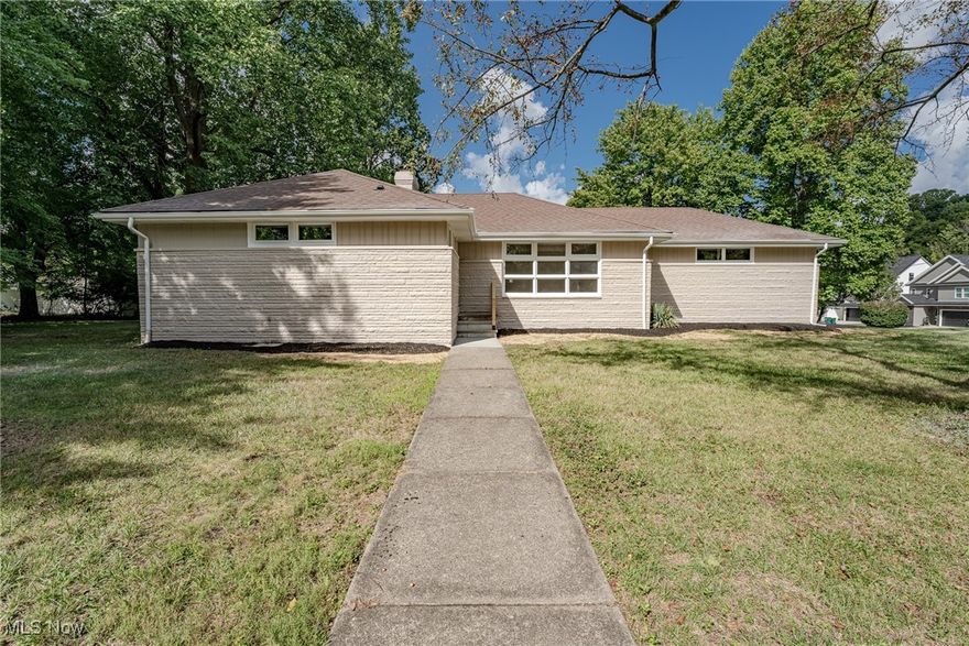 Welcome to 4834 Geraldine Road, a fully renovated ranch situated in Richmond Heights. This property boasts 3 bedrooms, 2 full bathrooms, and over 1400 square feet of living space. As you enter through the front door, you are greeted by the well-lit living room adorned with new windows, fresh LVP flooring, and a charming sandstone fireplace. Transitioning to the dining room, which seamlessly connects to the kitchen, you'll discover a breakfast bar, new cabinetry, new stainless steel appliances, tile backsplash, and quartz countertops. The kitchen also provides convenient access to the attached garage. The primary suite features carpeting and a private ensuite bathroom with a walk-in shower. Two additional bedrooms and another full bathroom complete the main level. The fully finished basement offers carpeting, a designated laundry area, and ample storage space. The exterior displays a blend of stone, wood, and brick, surrounded by a generous yard and an attached 2-car garage. Noteworthy, this lot size exceeds that of most neighboring residences on Geraldine Road.