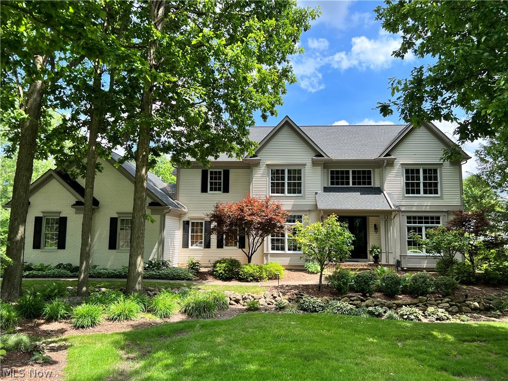 Lushly treed and deep set from the road, comfortable luxury awaits in the form of this aspirational colonial.