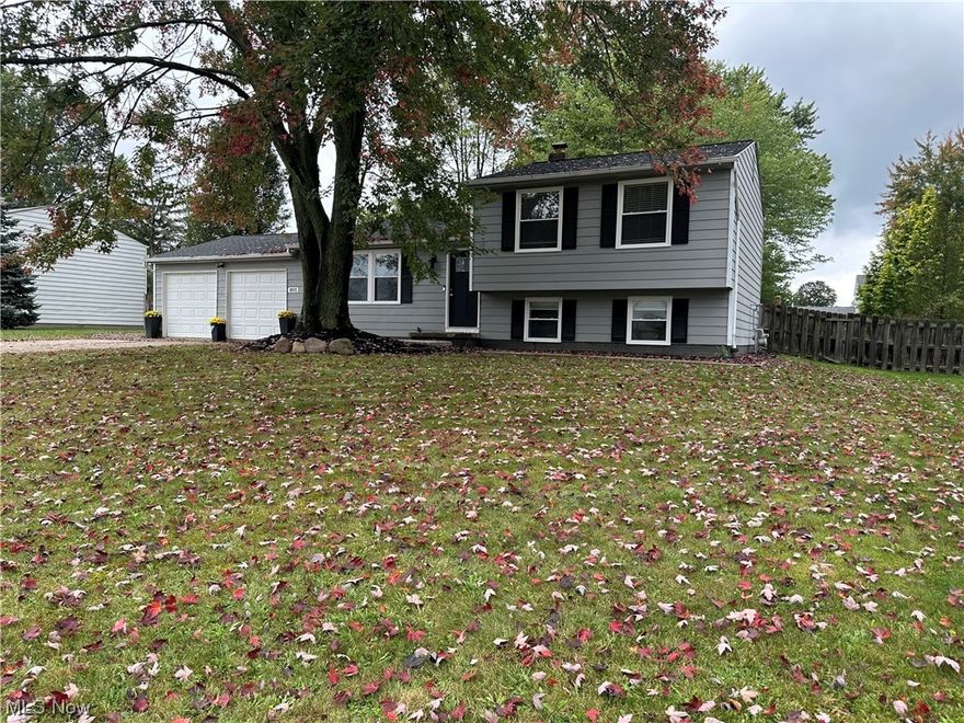 Move right into this inviting, modern style home! The first floor welcomes you with a bright living room and an open layout into the gorgeous kitchen with dark elegant cabinets, ceramic tile back-splash and stainless steel appliances are waiting for you.  The main floor features laminate floors (2022) throughout.  The Dining Room with sliding glass doors has access to the deck and a beautiful fenced backyard.  On the second  floor you find three bedrooms with a stylish, recently updated bathroom.  On the lower floor you will find a master bedroom with a walk-in closet, a master bathroom and a laundry. The finished basement awaits a bonus room with carpeting. House features a 2 car garage. Call for your private showing today!