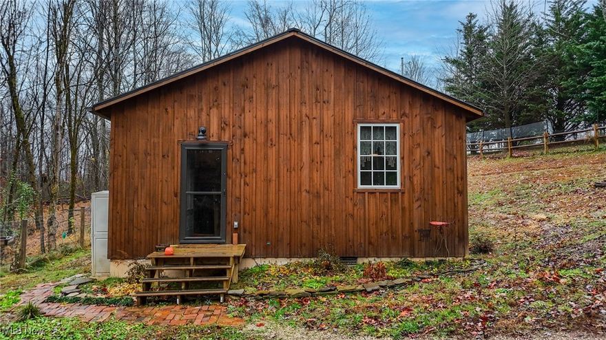 Check out this 2023 Amish-built cabin sitting on 15 acres, bordering Wayne National Forest. This one-of-a-kind cabin has been meticulously designed, featuring hardwood floors, pine ceilings, large windows, a screened-in porch, a tankless water heater, and a generator. On the property, you will find a large storage shed and a fenced-in yard. Whether you're looking to live the simple life or to have prime hunting land, this rare find is for you! Call for your showing today!