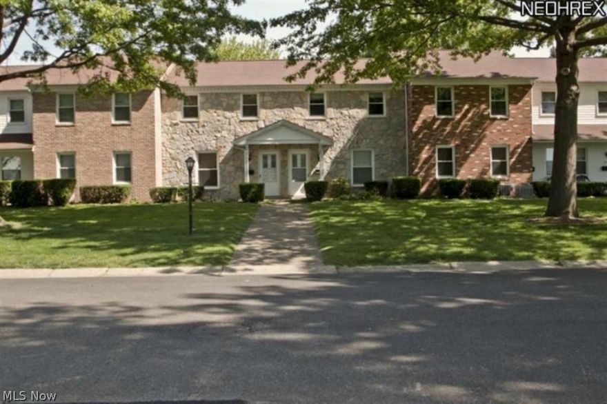 Beautifully updated townhome in North Canton!  gorgeous newly installed wood flooring on main level with large living room, half bath and spacious eat in kitchen.  Kitchen included brand new cabinetry, refrigerator, oven range and dishwasher.  Second level is all carpeted with a full main bath also featuring new flooring.  Very sizable bedrooms with ample closet space.  Lower level is partially finished with an oversized laundry area to double as storage space.  This unit comes with a 2 car carport that is directly connected to a beautiful rear patio.  Walk right inside your home.  Grounds are professionally maintained and managed.  Call now!