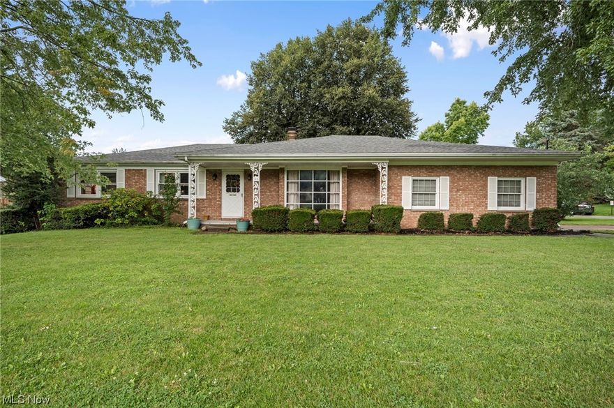 Charming brick ranch with front porch on a large corner lot. 3 bedrooms with hardwood floors,3 full baths. Living room with a fireplace and hardwood floors. Beautiful updated eat in kitchen with all the appliances included. Large family room , full partially finished walk out basement with large laundry area and workshop. Improvements include new kitchen, newer roof, newer AC, several new windows. The outside features a beautiful deck that is great for entertaining and plenty of storage. A must see.