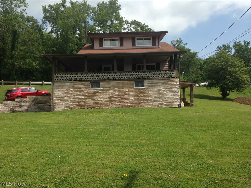 1 1/2 story house with 3 bedrooms.  One BR located on main floor and 2 upstairs.  First floor laundry space included in bathroom  Large concrete patio extends from side of house to front.  Replaced HWT 2016; CA 2015.  Carport in back of house and one car garage underneath front porch.