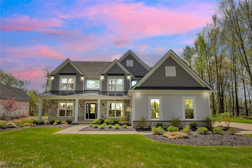 The Forestwood Model Home by Parkview Custom Homes! Welcome home to this gorgeous, open, first floor master design on a private wooded setting! This home features 4 Bedroom/3.5 Baths and is 4,028 sq ft. The Craftsman style front features a large front porch and a 3 car side entry garage. The 2 story foyer features custom wainscotting and an open staircase with metal spindles and craftsman newel posts. The large Dining Rm features wainscotting and a cross-beamed ceiling. The open Great Rm features a vaulted ceiling, direct vent fireplace and hardwood flooring. The soaring Kitchen features 12' ceilings, beamed ceiling, granite countertops with leather finish, subway tile backsplash, Stainless Appliances (oversized refrigerator/freezer & built in microwave/oven combo) walk in pantry & a large island for entertaining. The butler pantry/wetbar features a wine refrigerator, granite countertops/backsplash (w/leather finish) and sink. The First Floor Master with attached sitting rm includes floor to ceiling paneling & tray ceiling. The Large Master Bath features separated sinks, large tile shower and a large stand alone tub. The Large walk in Master Closet features custom closet shelving with an island. The rear hall features built in cubbies/bench. The 3 large bedrooms on the 2nd floor include two full attached baths and loft that overloooks the great room. 20'4''x15'9'' Covered Stamped Concrete Patio with stained ceiling. Full basement with 9' poured walls. Sprinkler System, Security System and is fully landscaped.