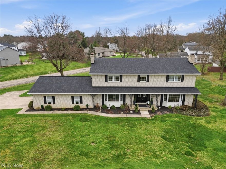 Classic center hall design colonial in Indian Village. Enter through double doors to a stunning 2 story foyer showcasing a dramatic circular staircase. Bayed formal living with one of the 3 fireplaces in this home, opens to the bayed formal dining room. Warm and inviting step down, bayed family room offers the second fireplace, and built in bookcases.  The light filled kitchen offers built-in double ovens, a smooth top range, built in microwave and dishwasher. An adjoining dinette leads to the convenient first floor laundry and serene screened in porch overlooking the backyard oasis with a newer patio offering privacy from the extensive landscaping. There is a full bathroom on the first floor. Find a reading nook, with a window seat flanked by two closets on the second floor over looking the foyer. The 4 bedrooms and 2 full bathrooms are on the spacious second floor, includes the primary suite with a walk-in closet and a full bathroom with new (2/2026) LVP flooring. All the bedrooms are generously sized! The lower level is finished with an office and a recreation room featuring the third fireplace. This is a quality custom built all brick home with 3 fireplaces, pocket doors from the kitchen to the family, in the primary suite and the full bathroom on the second floor. The garage has glazed tile walls, and offers a second access to the basement. Ready to make new family memories!