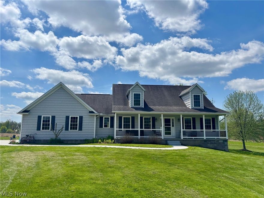 Built in 2006 and set on 34 private acres, this 4-bedroom, 2.5-bath home with 2,800+ sq ft is designed for true one-floor living, offering privacy and functionality. A long covered front porch welcomes you into a bright interior featuring a vaulted living room, main-floor laundry, and cherry Pergo flooring throughout. The main-level primary suite includes an updated en-suite bath (2025) with custom cabinetry, quartz countertop, and a Kohler walk-in tub with lifetime warranty—allowing you to comfortably live day-to-day entirely on the main level.

The kitchen with granite countertops overlooks the property and opens to a dining area with slider access to a 10x20 composite deck with electric retractable awning, perfect for enjoying the views. Upstairs offers two bedrooms and a full bath, while the finished walk-out basement adds flexible living space with a recreation area, fourth bedroom, milled cherry crown molding, office, storage, and plumbing for an additional future bathroom.

Enjoy year-round comfort with a heat pump providing heating and central A/C, complemented by a wood-burning furnace for backup heat or added energy savings. Major updates include all new ProVia windows, a kitchen slider, and three exterior doors (2026)—all backed by a lifetime warranty.

Additional features include a 2-car attached garage and a 32x40 outbuilding with an additional 8' overhang and 100-amp electric, ideal for a workshop, storage, or hobby space. The property offers ample road frontage with potential to parcel off and sell a portion if desired.

A one-year home warranty is included. Enjoy the best of both worlds—convenient access to highways and nearby city centers, yet far enough away to experience true country living with peaceful surroundings, room to hunt, space for animals, and the simple sounds of nature. A rare opportunity for those seeking acreage, privacy, outbuilding space, and future investment potential.