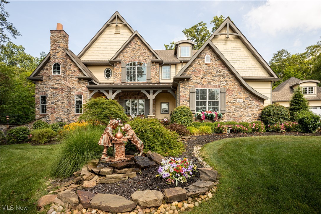 This magnificent French Country estate on nearly four private acres within an exclusive cul-de-sac was originally featured in the prestigious Parade of Homes. The architectural masterpiece showcases stone, cedar, and Hardiboard exterior with dual stone chimneys and premium Pella thermal windows. The grand interior spans 6,207 square feet with soaring vaulted ceilings and custom ceiling beams throughout. Five bedrooms with walk-in closets and four and one-half bathrooms feature exquisite tile and granite finishes. The spectacular kitchen centers around a nine-by-seven-foot granite island, flowing seamlessly into the vaulted hearth room and breakfast area. The dramatic two-story great room, overlooked by a charming bedroom loft, showcases one of four interior gas fireplaces. Two stunning glass sun rooms provide year-round enjoyment—one adjoining the primary suite overlooking manicured grounds, another enclosing a relaxing hot tub. The fully finished walk-out basement offers billiards area, wet bar, wine tasting room with chiller, and dedicated theater space. The outdoor paradise features a heated in-ground pool with cascading rock waterfall, gazebo, greenhouse, playhouse, tool shed, plus comprehensive sprinkler systems and elegant front and back landscape illumination.This home is a must see! Call Today for private showing!