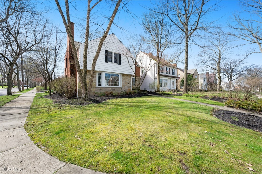 This well-maintained colonial offers classic curb appeal and thoughtful updates throughout. Featuring Andersen windows, updated electrical, and a hot water tank installed in 2021. The newer stainless steel kitchen appliances all stay, and the heating coils on the slate roof add seasonal efficiency. Gutters were cleaned in March, and both the hot water tank and A/C were serviced in April 2025 for peace of mind. Step into a spacious living room with a cozy fireplace wall flanked by floating shelves and a lovely bay window that invites natural light. The formal dining room includes timeless built-in corner cabinets, while the eat-in kitchen boasts stainless steel appliances, a built-in dining table, and bench seating. Enjoy easy entertaining with a first-floor powder room, an enclosed sunroom, and a generous main-level family room with sliding doors leading to a private brick patio ideal for relaxed mornings or gathering with guests. Upstairs, the expansive primary bedroom features three separate closets and a built-in vanity. Two additional bedrooms include unique touches, one with a private balcony, the other with a charming nook and dual closets. A full bathroom with both a soaking tub and separate shower completes the second floor. Beautiful hardwood floors flow throughout. The finished lower level offers a second fireplace and carpeting, perfect for a playroom, media room, or cozy retreat. The large laundry area feels fresh and functional with newer flooring and its own half bath. Outdoor living is just as enjoyable, the elevated patio overlooks manicured landscaping, a spacious backyard, and a two-car garage that rounds out this fantastic property. Conveniently located near shopping, dining, hospital systems, and just minutes from downtown. Schedule your visit today and come see it for yourself.