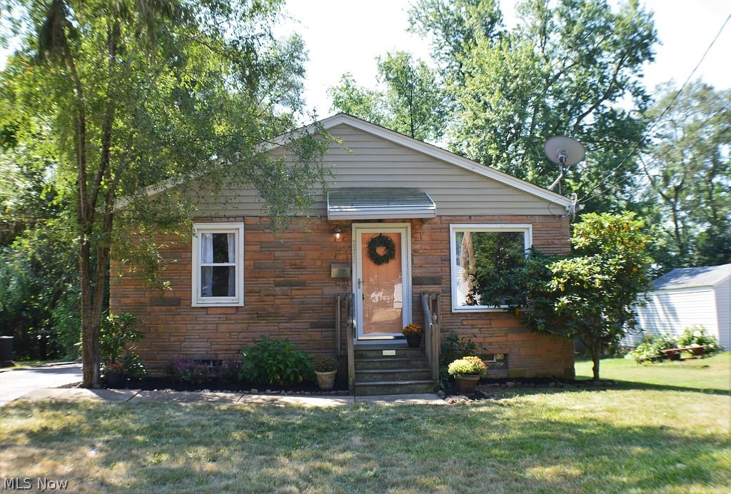 This three bedroom, 2 full bathroom ranch home looks and shows like a new home. The home has one floor living with all bedrooms, kitchen, large bathroom (with jacuzzi tub) and living room on the main floor. A 10X12 wood deck is off one of the bedrooms. The lower level has two large spaces for additional living with a huge 32X13 area with glass block windows, bar, and sink area...perfect for large gatherings. The outside garage area has ample electric boxes and lights and would be considered a two and one half car garage. Come and see this beautiful home in Goodyear Hts.