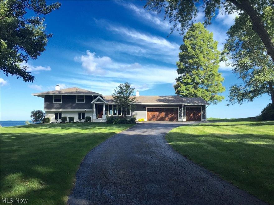 Prime Lake Erie Front, private & set back not visible from the street!  NOT A THING to do here, just MOVE in to this RARE 4 level split!  Honored to bring this property on the market. The homeowners have updated nearly every inch of this home & exterior.  Property has unobstructed views from rear of the home including wall of windows in oversized master bedroom (previously 2 bedrooms converted to larger). Large front living room currently used as formal dining room & opens to view the remainder of the house floor plan.  From this front room to the left are the (up)stairs that lead to 2 bedrooms, large bathroom w/ soak tub & gorgeous shower. Look forward to the great room featuring wall of windows, small gas fireplace & slider to patio area. To the right is the open kitchen, dining area, recently converted mud room/laundry & access to attached 3 car garage. 3rd bay used as workout rm.  To the left are the (down)stairs to family rm. featuring stone fireplace w/ sliders to the rear & hall