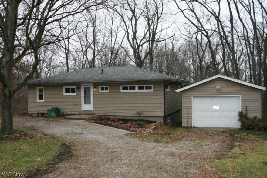 Recently updated 3 bedroom ranch nestled in the woods. This home features beautiful eat-in kitchen, living room, 3 bedrooms and 1 full bath. 1 car detached garage. The walk out basement leads to a large backyard. Quiet country living, but near to every convenience. For your peace of mind, the sellers are including a one year home warranty. Updates include : furnace '13, hot water tank '13 & most of the windows have been replaced. Call today about this great home & check out the amazing views for yourself.