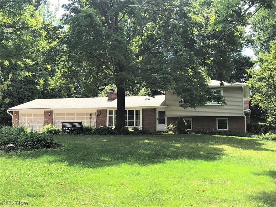 Fabulous Bath Twp. home on 1.89 scenic acres w/creek in desirable Meadow Park.  This one of a kind home boasts numerous updates and amenities including 4 fireplaces.  Welcoming formal living room w/woodburn fireplace leads to formal dining room and kitchen, all with vinyl plank flooring.  Gourmet kitchen features newer SS appliances and granite countertops (2020), and separate eating area.  Enjoy views of the wooded grounds from the inviting vaulted sunroom, with skylights, and the multi-level deck. 
Awesome great room with gas fireplace and 12' ceiling perfect for large gatherings.  Owners suite includes private bath and oversized laundry room complete this level.  The second floor offers 3 bedrooms and 2 full baths, one en-suite.  Spacious lower level highlights family/rec room and tons of storage closets (incl. cedar).  3 c attached garage.  
Notable updates (2018-2020), furnace, water heater, roof, siding, gutters, water softener, well pump, windows, and flooring.  A/C (2015).  B