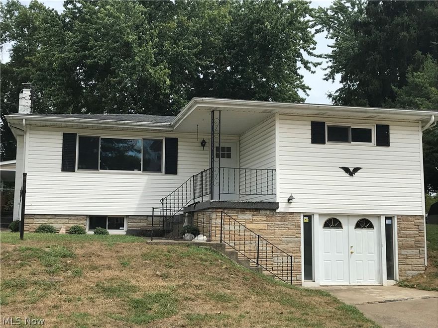 Completely remodeled inside. New kitchen, new bathroom, new doors and trim. Hardwood floors, new carpet in family room. New roof. Large corner lot with 2 stall detached garage.