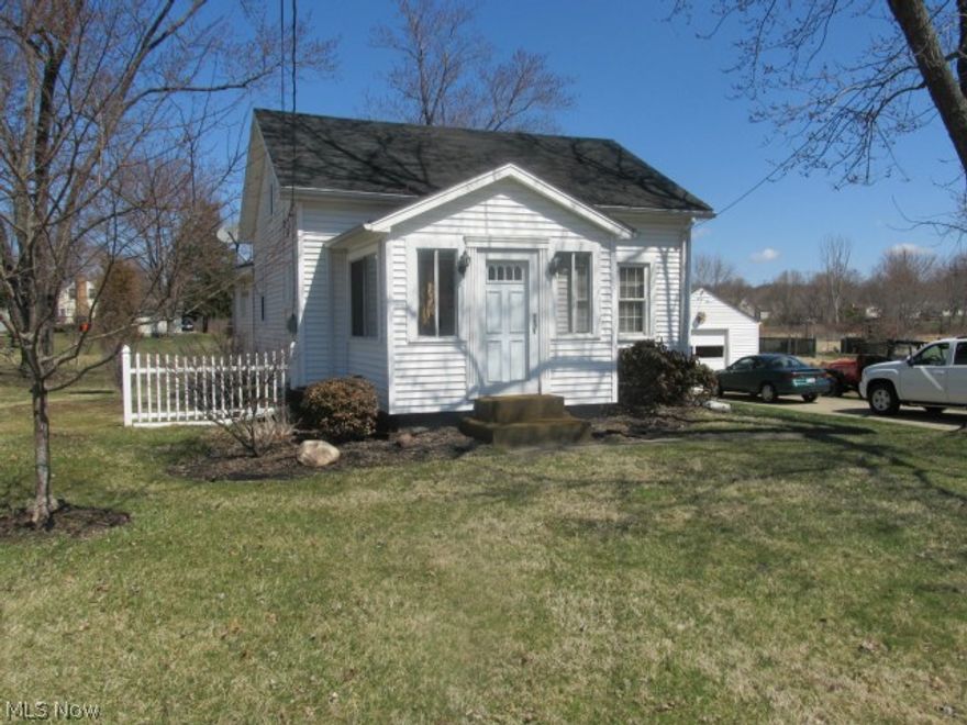 Cute as can be.  Two story well maintained home on large 140x240 lot, dead end street, & Champion Schools.  Perfect starter home or for the person who is looking to downsize. Very large eat-in kitchen with open floor concept to dining area, new laminate flooring. Large living room.  First floor updated full bath & office/computer room. 2 bedrooms upstairs.  Partially finished basement, glass block windows & shower. Enclosed front porch. New 10x12 rear deck 2013.  Large patio & yard for entertaining. Home has newer vinyl siding & windows & most rooms are freshly painted.