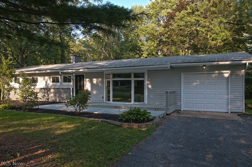 Twin Lakes Estates welcomes you to this professionally renovated ranch on a cul-de-sac street with absolute charm and character throughout!  Greeting your entry you will find amazing flooring and an open concept feel that will warm your heart and make you feel right at home.  The kitchen will surely impress with beautiful granite counters and breakfast nook and dark mocha cabinets complete with stainless steel appliances and subway tile backsplash....WOW! The master suite boasts a walk-in closet and it's own master bath complete with beautiful tile flooring! Entertain with ease in the large open living room which opens right up into the dining area.  Enjoy the fall morning sun in the fully enclosed sun room which opens up to the even larger deck area. This is truly one amazing back yard with two sheds and completely surrounded by woods.  Come over, come in, and I will bet you'll want to stay...