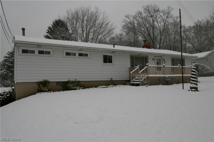 Welcome home! This lovely ranch on 1.47 acres backs up to the Portage Lakes State Park - truly a beautiful property. Large driveway with a 2 car heated garage. Partial fenced in backyard, chain link area fully enclosed for your pets. Huge 30x16 foot outbuilding with electric. Deck behind home with great view of the backyard. Appliances stay! Large screened in patio was converted into family room for additional living space. New roof 2015, new hot water tank 2020, new well pump 2018. Well and septic point of sale already completed.