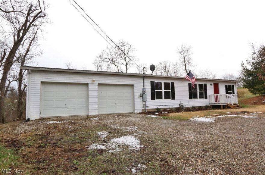 Great 3 bedroom, 2 bath manufactured home on a permanent foundation with an attached 2 car garage and big back yard.  Master bedroom with walk in closet, master bath features garden tub with seperate shower.  All new floor coverings and paint.  Property being sold "as is"